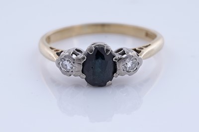 Lot 86 - A sapphire and diamond three-stone ring