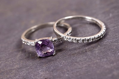 Lot 102 - An amethyst and CZ single-stone ring; and a cubic zirconia half hoop eternity ring