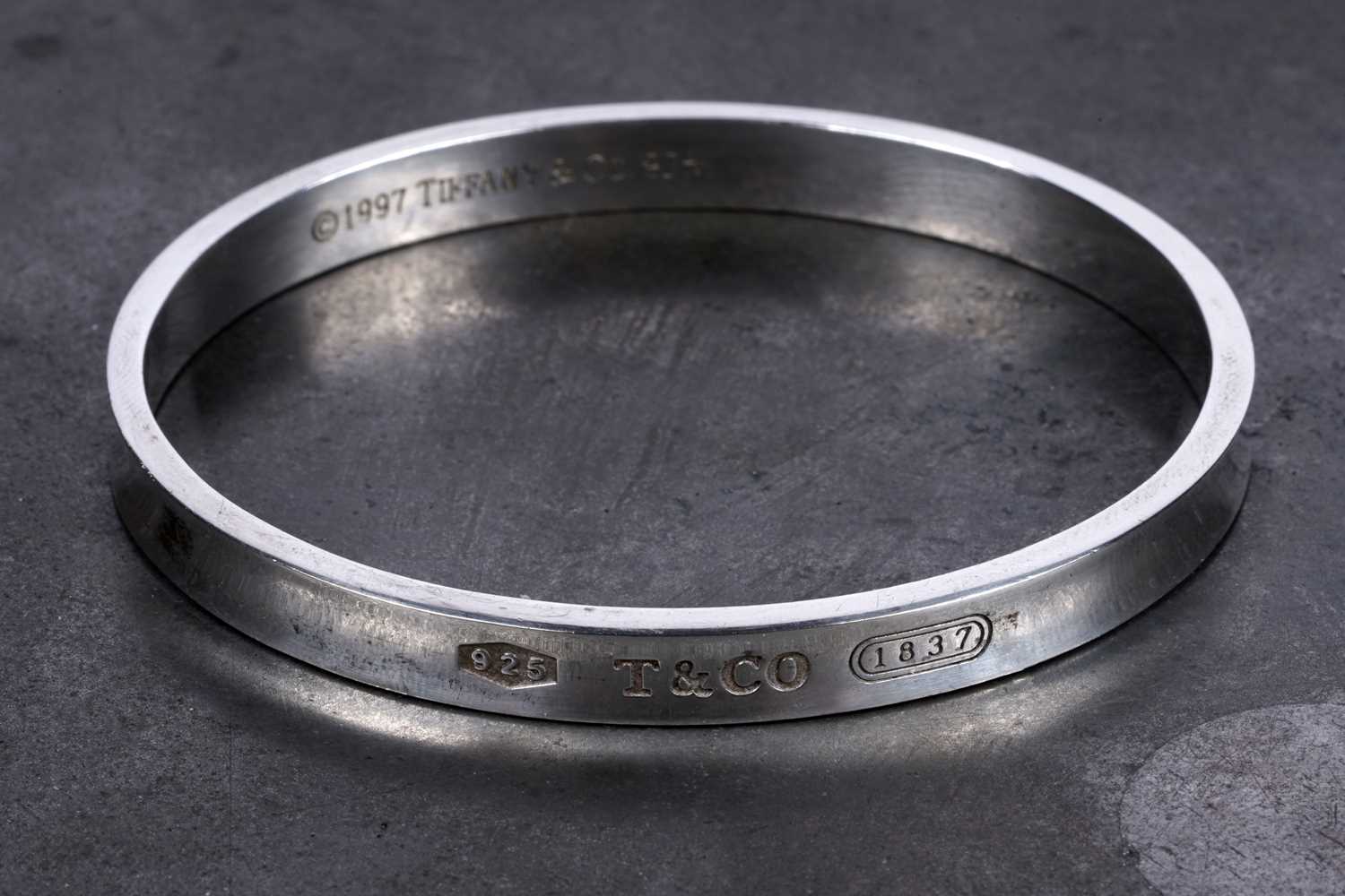 Lot 67 - A Tiffany and Co sterling silver bangle