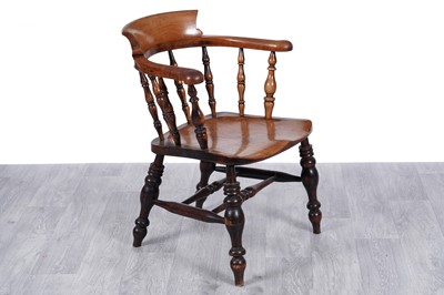 Lot 108 - A 19th Century beech and elm smoker’s armchair