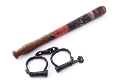 Lot 94 - A Victorian painted truncheon, by Field of Holborn; and a pair of wrought iron handcuffs