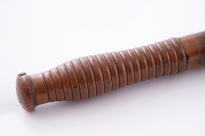Lot 94 - A Victorian painted truncheon, by Field of Holborn; and a pair of wrought iron handcuffs