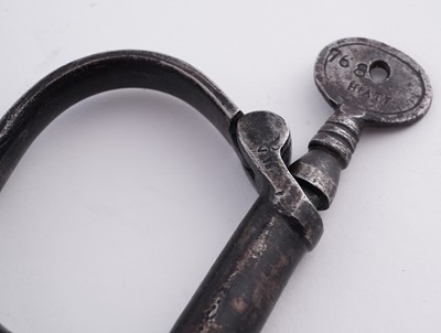 Lot 94 - A Victorian painted truncheon, by Field of Holborn; and a pair of wrought iron handcuffs