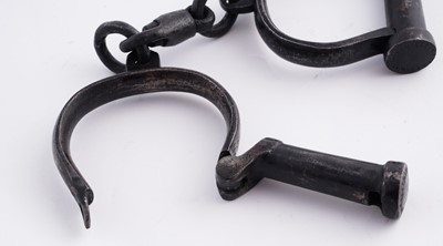 Lot 94 - A Victorian painted truncheon, by Field of Holborn; and a pair of wrought iron handcuffs