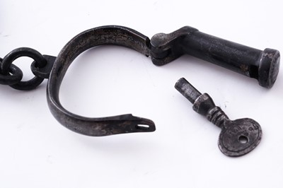 Lot 94 - A Victorian painted truncheon, by Field of Holborn; and a pair of wrought iron handcuffs