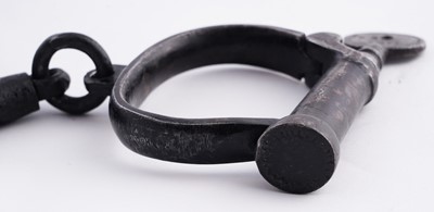 Lot 94 - A Victorian painted truncheon, by Field of Holborn; and a pair of wrought iron handcuffs
