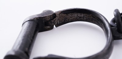Lot 94 - A Victorian painted truncheon, by Field of Holborn; and a pair of wrought iron handcuffs