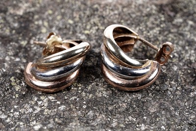 Lot 63 - A pair of 9ct tri-colour gold hoop earrings