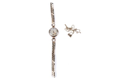 Lot 134 - A lady's 9ct gold cased cocktail watch; and a 9ct gold chain