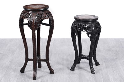 Lot 72 - Two Oriental carved jardiniere stands