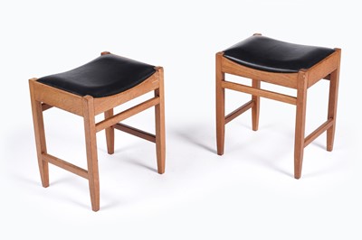Lot 556 - A pair of teak stools