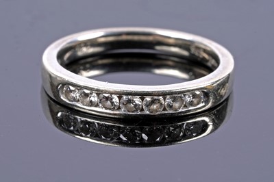 Lot 59 - A half hoop diamond eternity ring