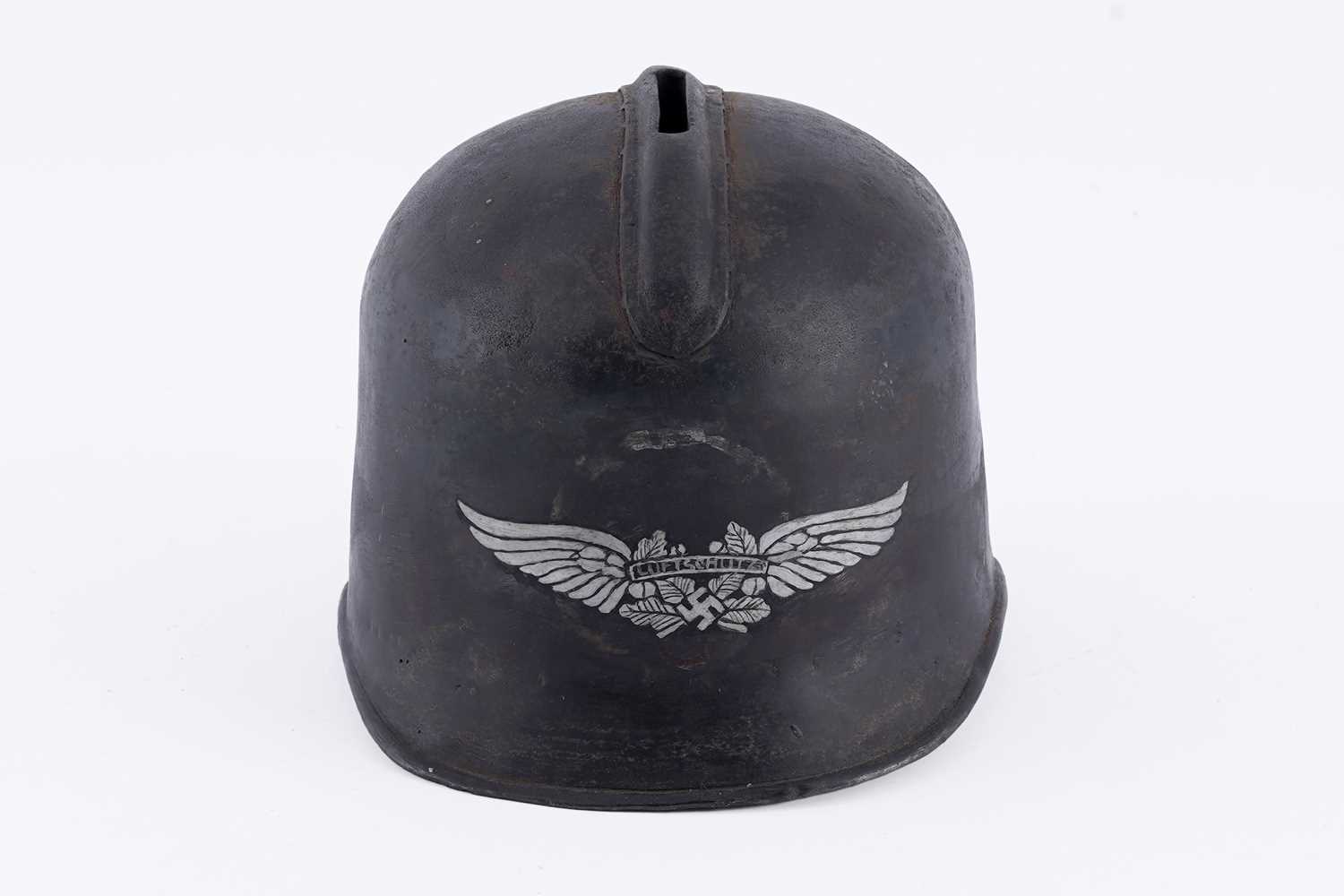 Lot 31 - A Luftwaffe helmet pattern money box