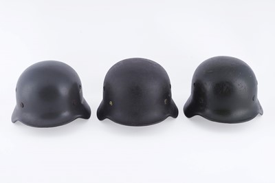 Lot 37 - Three German M40 helmets