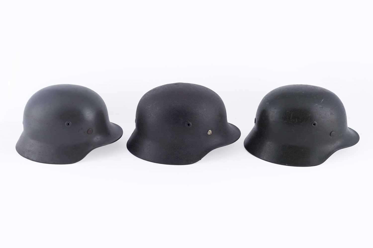 Lot 37 - Three German M40 helmets