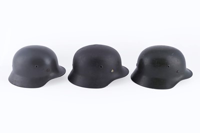 Lot 37 - Three German M40 helmets