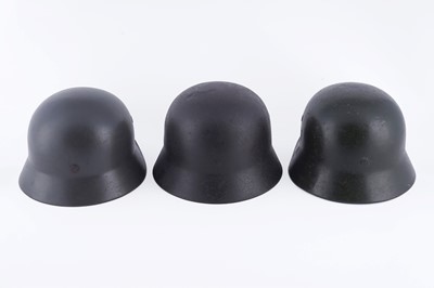 Lot 37 - Three German M40 helmets