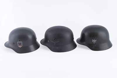 Lot 37 - Three German M40 helmets
