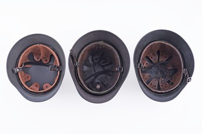 Lot 37 - Three German M40 helmets