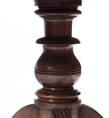 Lot 1057 - A Regency style mahogany three pillar pedestal dining table