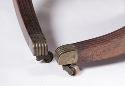 Lot 1057 - A Regency style mahogany three pillar pedestal dining table