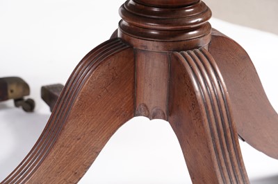 Lot 1057 - A Regency style mahogany three pillar pedestal dining table