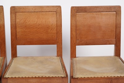 Lot 1073 - Robert ‘Mouseman’ Thompson: a set of four oak panel back dining chairs