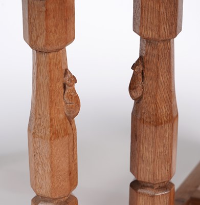 Lot 1073 - Robert ‘Mouseman’ Thompson: a set of four oak panel back dining chairs