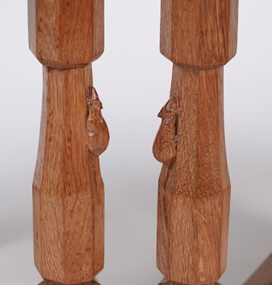 Lot 1073 - Robert ‘Mouseman’ Thompson: a set of four oak panel back dining chairs