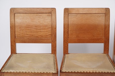 Lot 1073 - Robert ‘Mouseman’ Thompson: a set of four oak panel back dining chairs