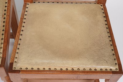 Lot 1073 - Robert ‘Mouseman’ Thompson: a set of four oak panel back dining chairs