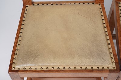 Lot 1073 - Robert ‘Mouseman’ Thompson: a set of four oak panel back dining chairs