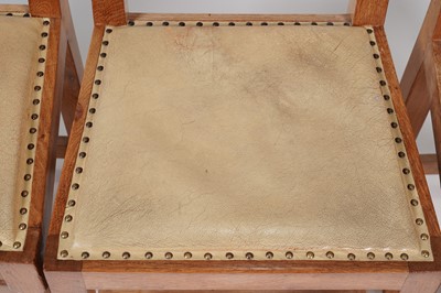 Lot 1073 - Robert ‘Mouseman’ Thompson: a set of four oak panel back dining chairs