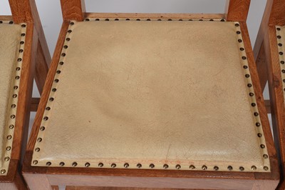 Lot 1073 - Robert ‘Mouseman’ Thompson: a set of four oak panel back dining chairs