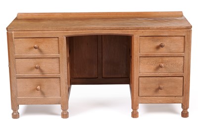 Lot 1077 - Robert ‘Mouseman’ Thompson: an oak panelled kneehole desk