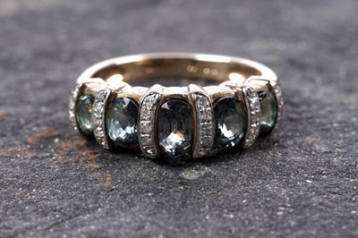 Lot 97 - A synthetic green sapphire and diamond ring