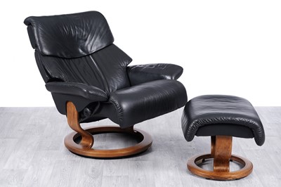 Lot 133 - Ekornes ‘Stressless’: a black leather reclining armchair and matching footstool