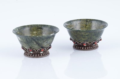 Lot 834 - A pair of Sino-Tibetan spinach green nephrite bowls