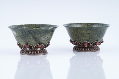 Lot 834 - A pair of Sino-Tibetan spinach green nephrite bowls