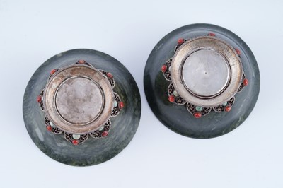Lot 834 - A pair of Sino-Tibetan spinach green nephrite bowls
