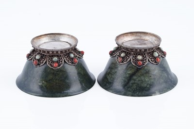 Lot 834 - A pair of Sino-Tibetan spinach green nephrite bowls