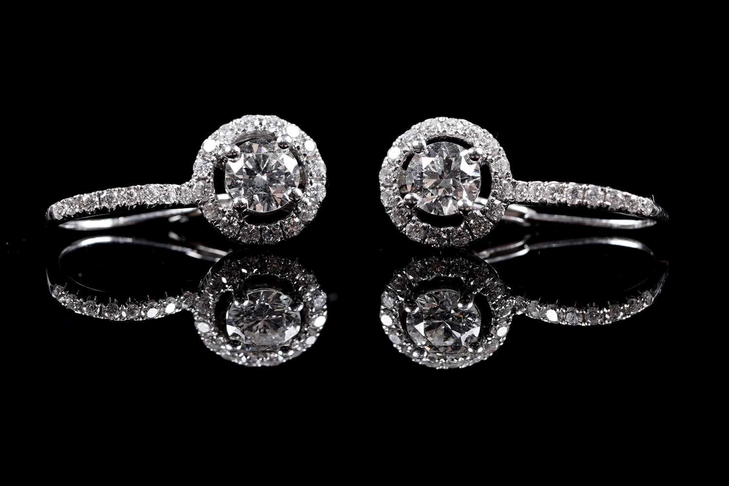 Lot 927 - A pair of diamond cluster earrings