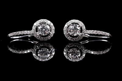 Lot 927 - A pair of diamond cluster earrings