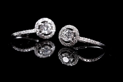 Lot 927 - A pair of diamond cluster earrings