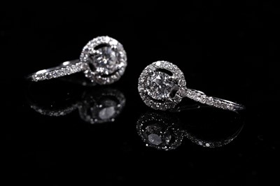 Lot 927 - A pair of diamond cluster earrings
