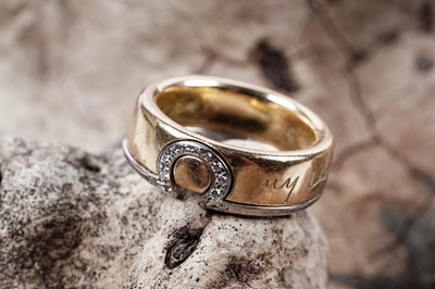 Lot 42 - A contemporary Omega My Choice diamond and 18ct gold wedding ring set