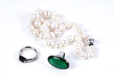Lot 90 - Modernist jewellery including: a Georg Jensen Danish silver and green quartz cabochon ring