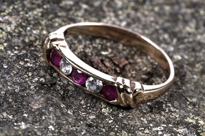 Lot 41 - A modern ruby half hoop eternity ring