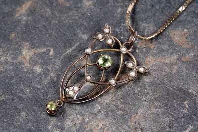 Lot 15 - An Edwardian Art Nouveau seed pearl and paste openwork pendant