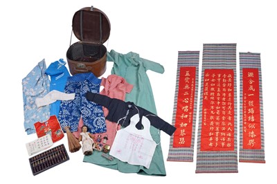 Lot 520 - A collection of Qing Chinese clothing and dolls for a child